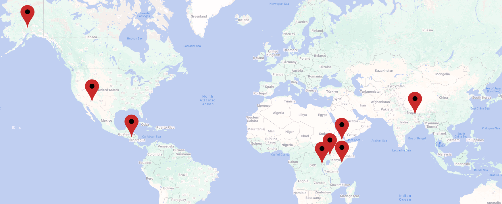 World map showing multiple red location pins across North America, Central America, Africa, the Middle East, and South Asia.